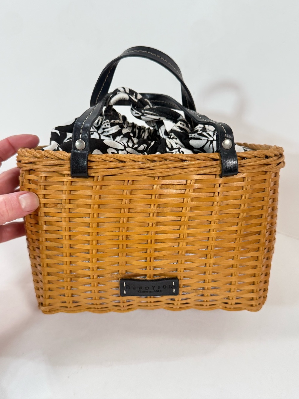 KENNETH COLE REACTION Black and White Floral lined mini wicker bag.
